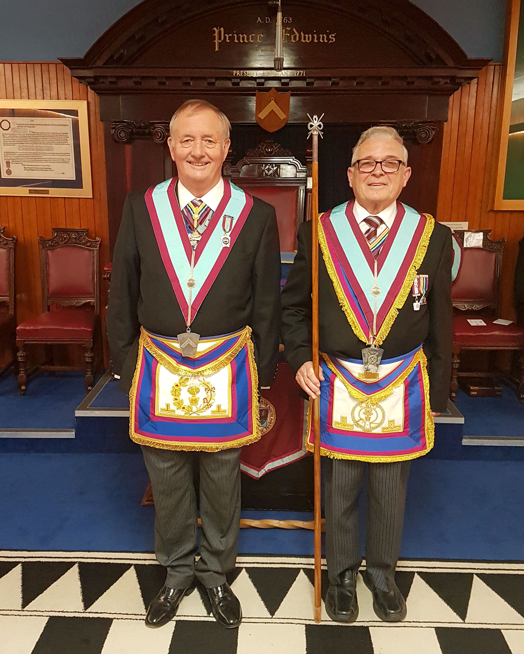 The Deputy Grand Master and the District Grand Secretary celebrate together