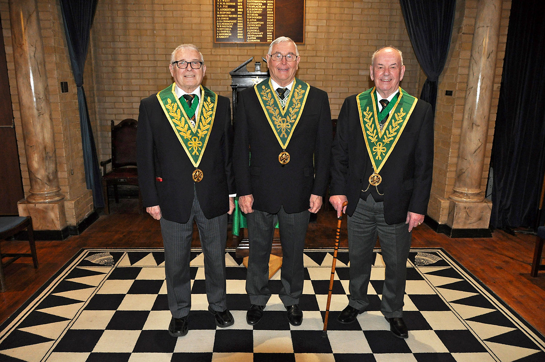 W.Bro. Geoff Whale (Dep. D.G.P.) with W.Bro.'s Derek Wilkins (D.G. Sec) and Paddy Langdown (D.G.S.W.). 