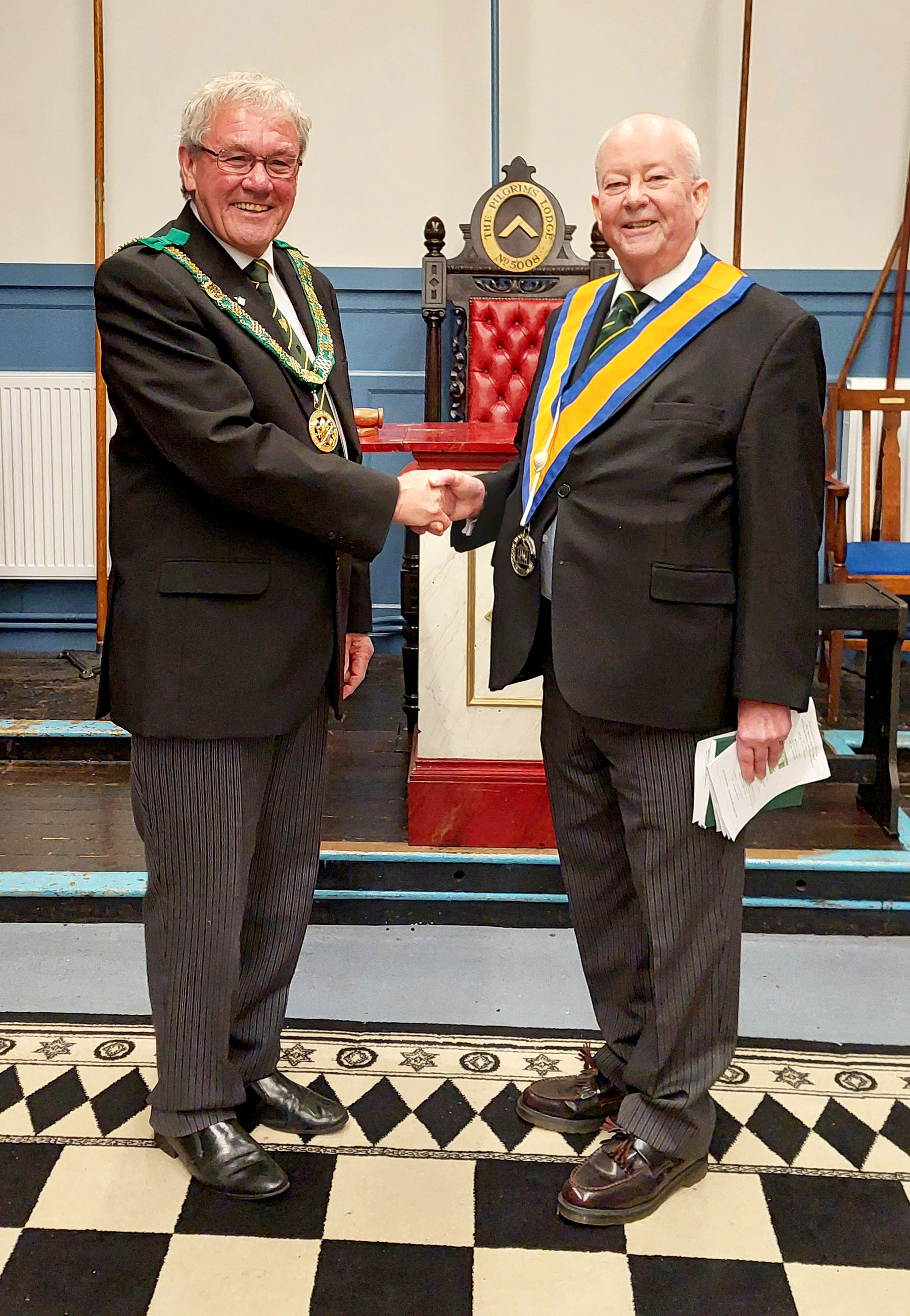 The D.G. P. congratulates W.Bro. Nigel Cash following his installation as Master of the Council