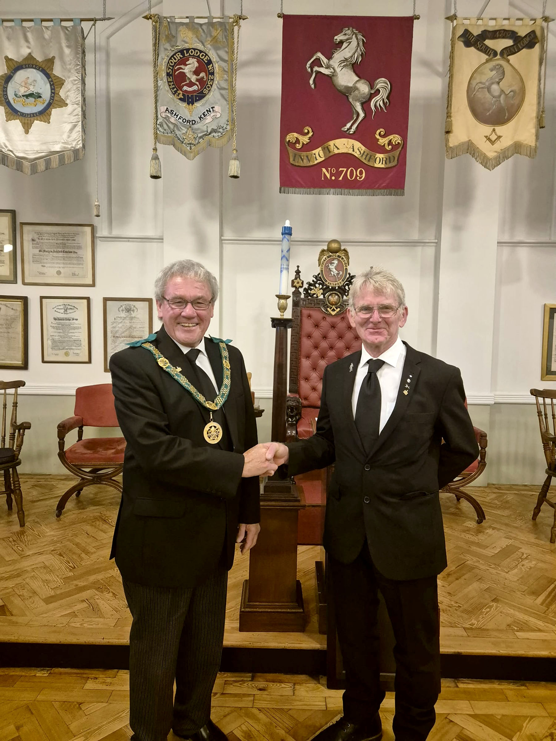 The District Grand Prefect R. W.Bro. Brian Ward welcome Bro. Peter Walkden to the Order