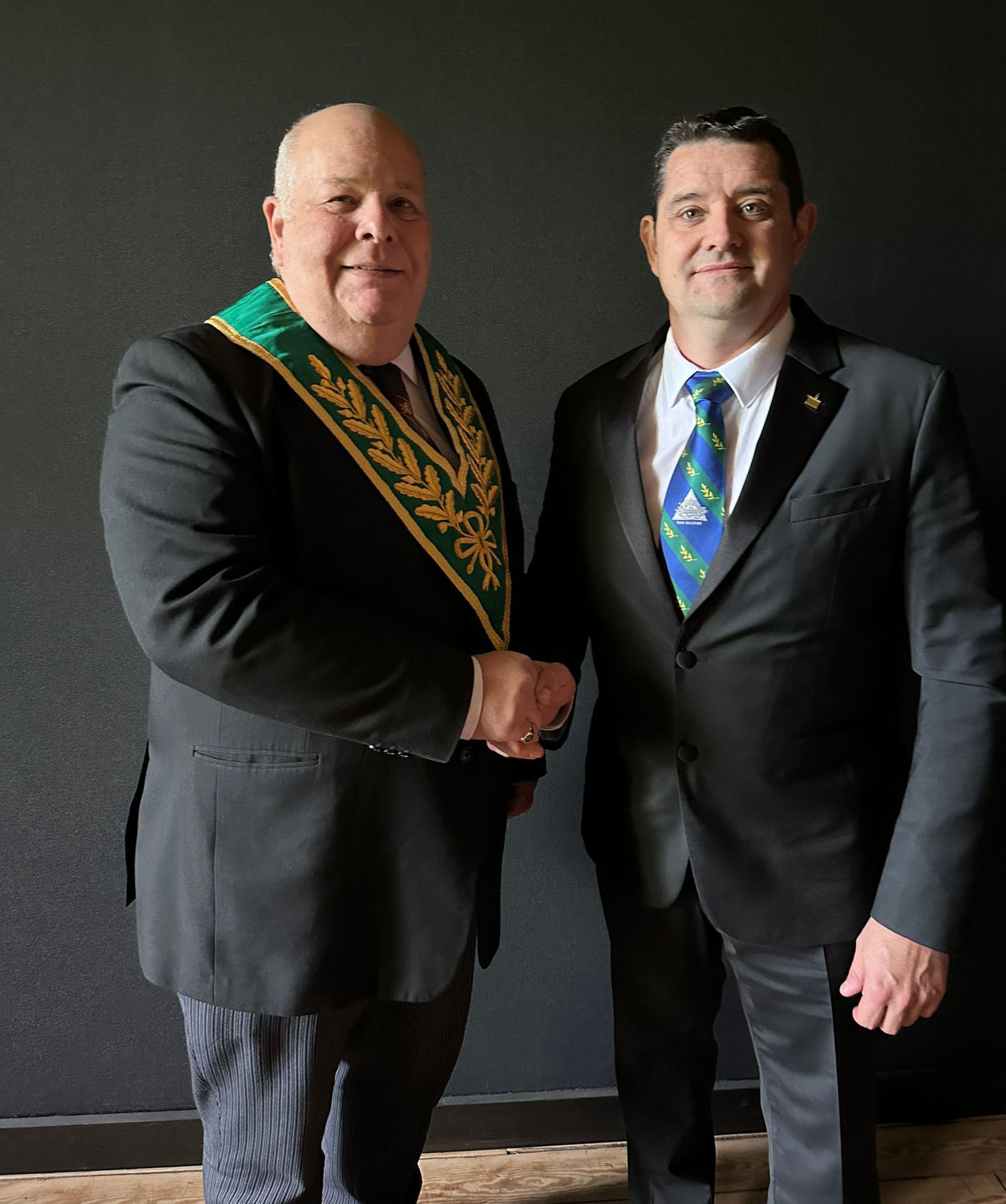 The Worshipful Master, W. Bro. Phil Clare, welcomes their latest member Bro. Didier Hannaert