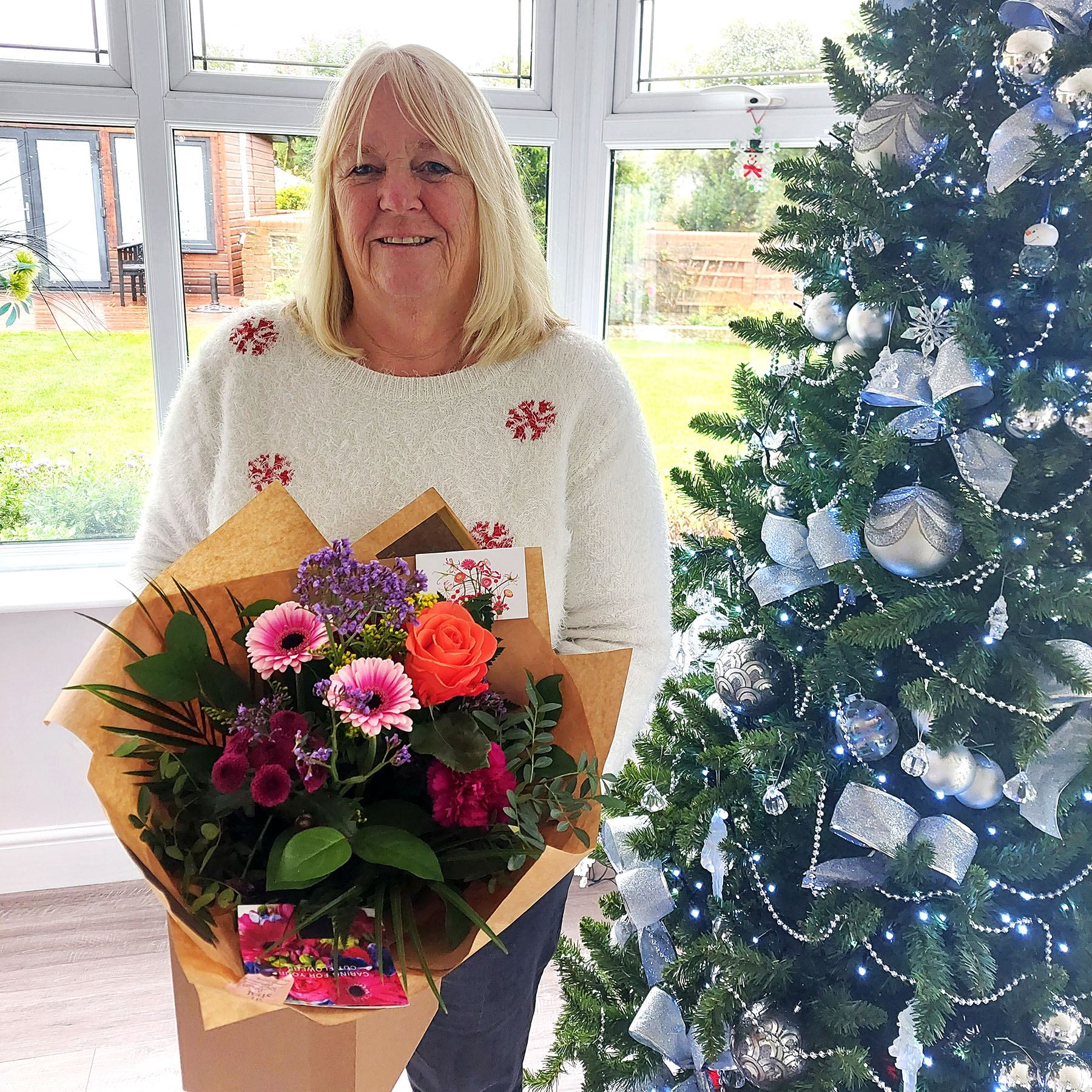 The DGP's wife Toni with flowers from the Exec