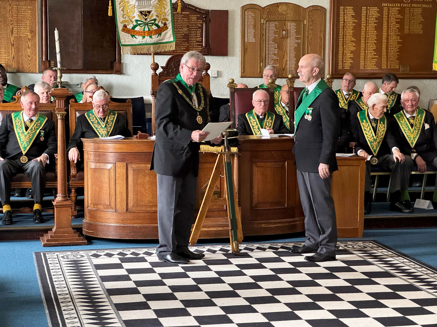 The District Grand Prefect for Kent R. W. Bro. Brian Ward accepts the Grand Master's Keystone Fund Collarette and Certificate on behalf of Brethren from the District of Kent  from W.Bro Archie Torrance (President of the Mark Benevolent Fund)