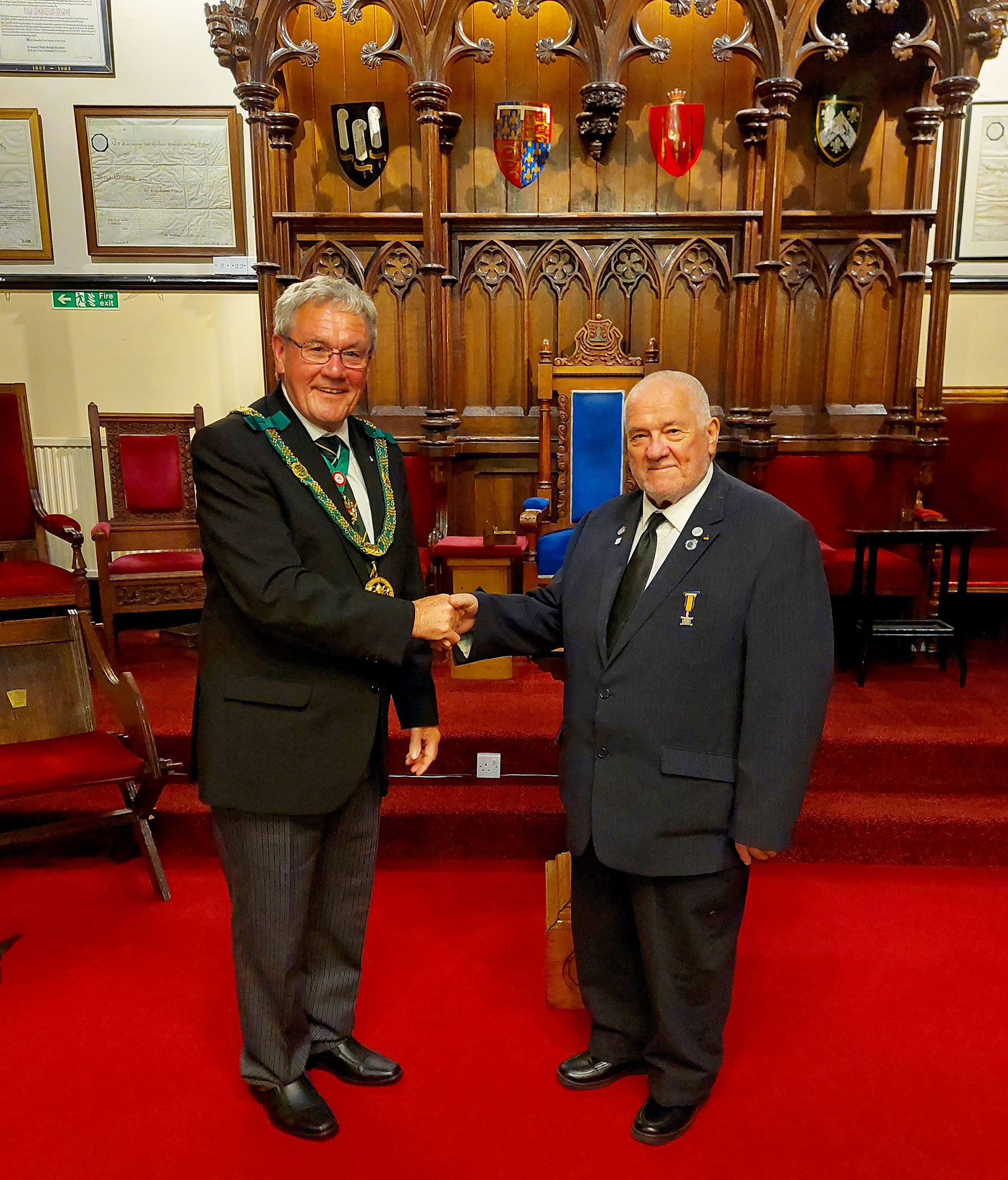 The District Grand Prefect R. W.Bro. Brian Ward welcomes Bro. Neil Drakley to the Order