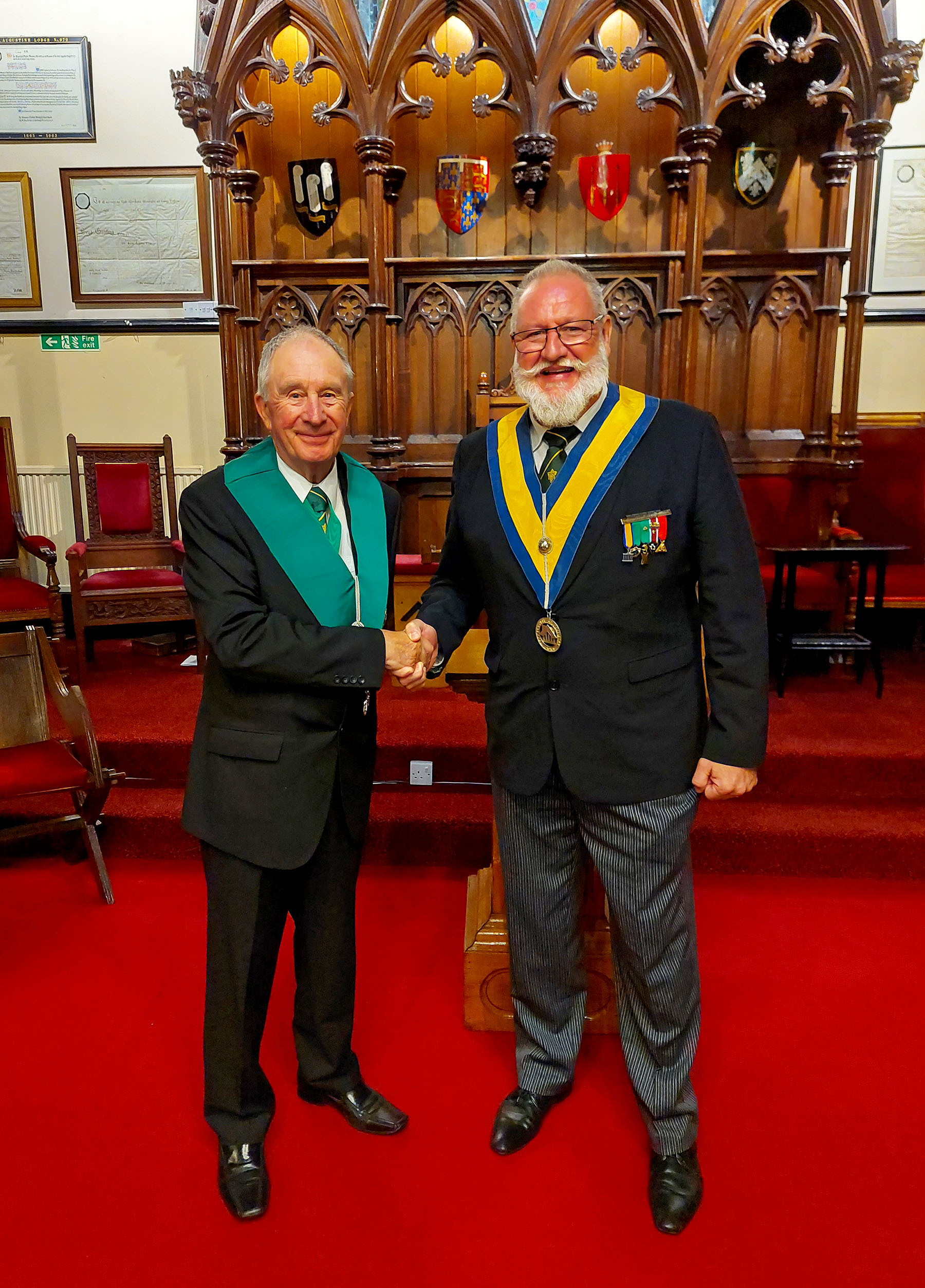 Our Ubiquitous Visitor Bro. Peter Hayler is welcomed by the Worshipful Master W. Bro. Pierre Ambrody