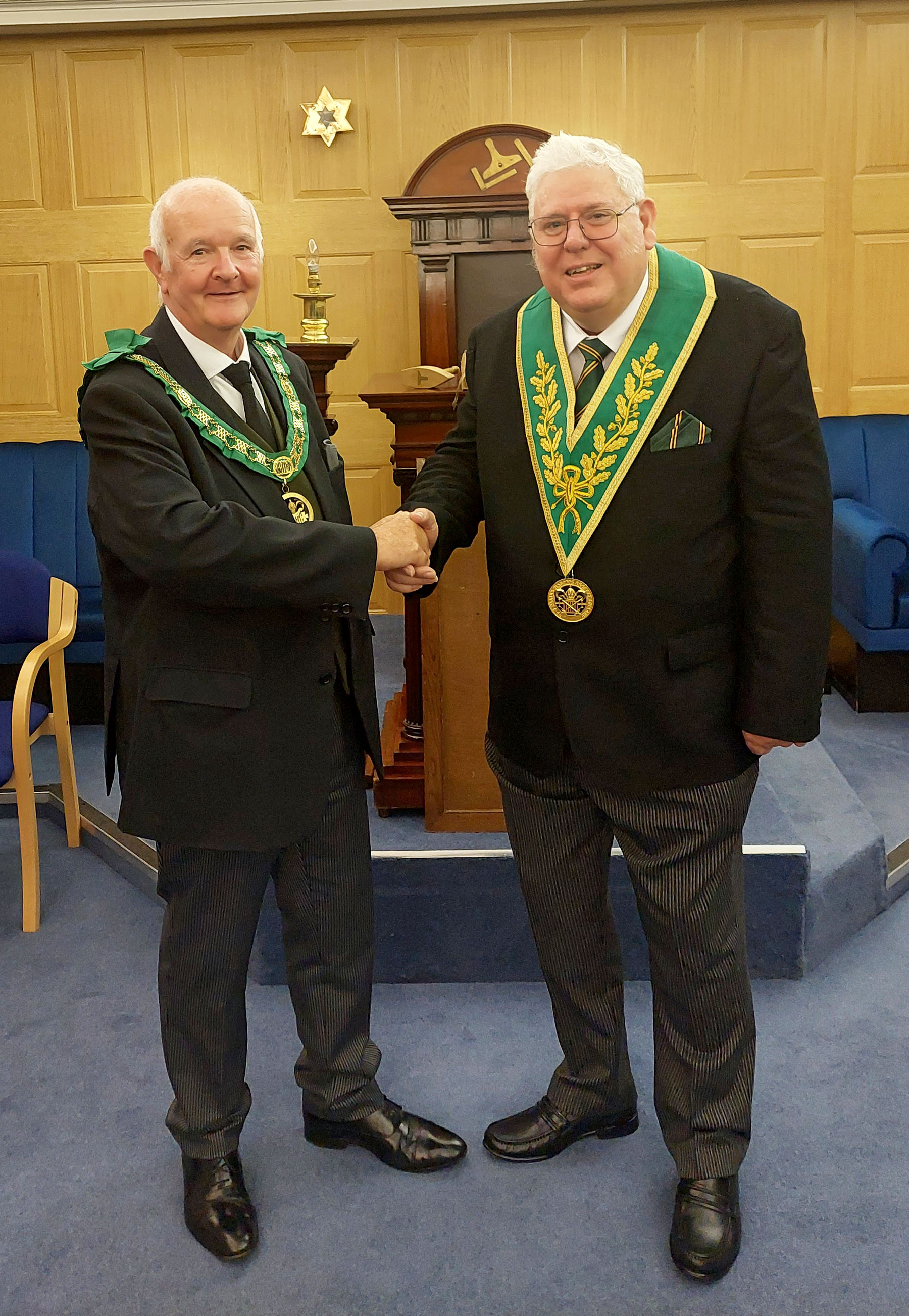The W.M of the Shuttleworth Council W.Bro. Graham Bainbridge is congratulated by the D.G.P. for East Lancs R.W.Bro. Graham Newton