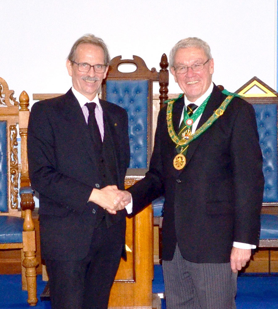 The District Grand Prefect. R.W.Bro. Brian Ward welcomes Bro. Ian Gallehawk to the Order