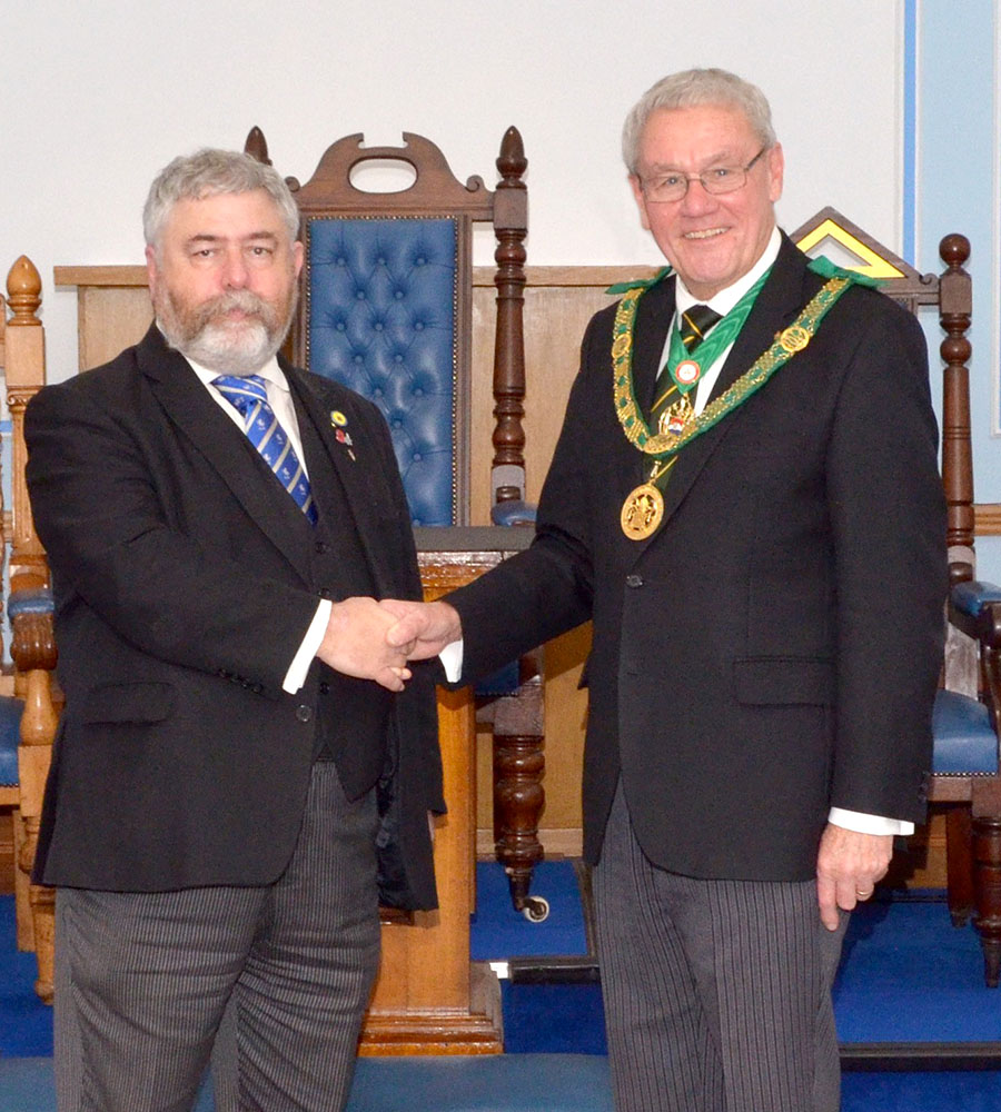 The District Grand Prefect. R.W.Bro. Brian Ward welcomes Bro. Simon Baker to the Order