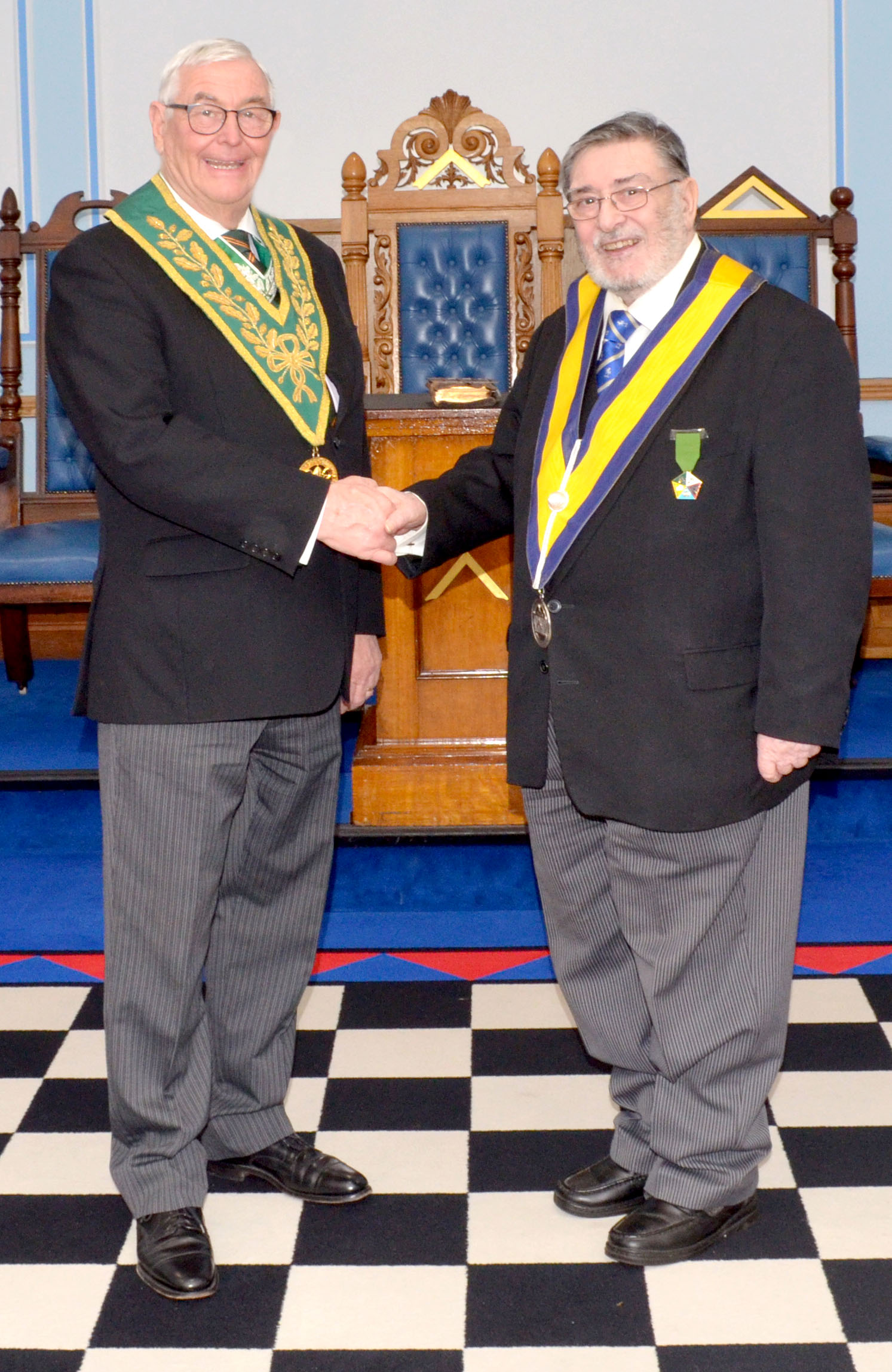 The Deputy District Grand Prefect W.Bro. Geoff Whale congratulates the new Master of he Councci W.Bro. Denis Babbington-Callnon
