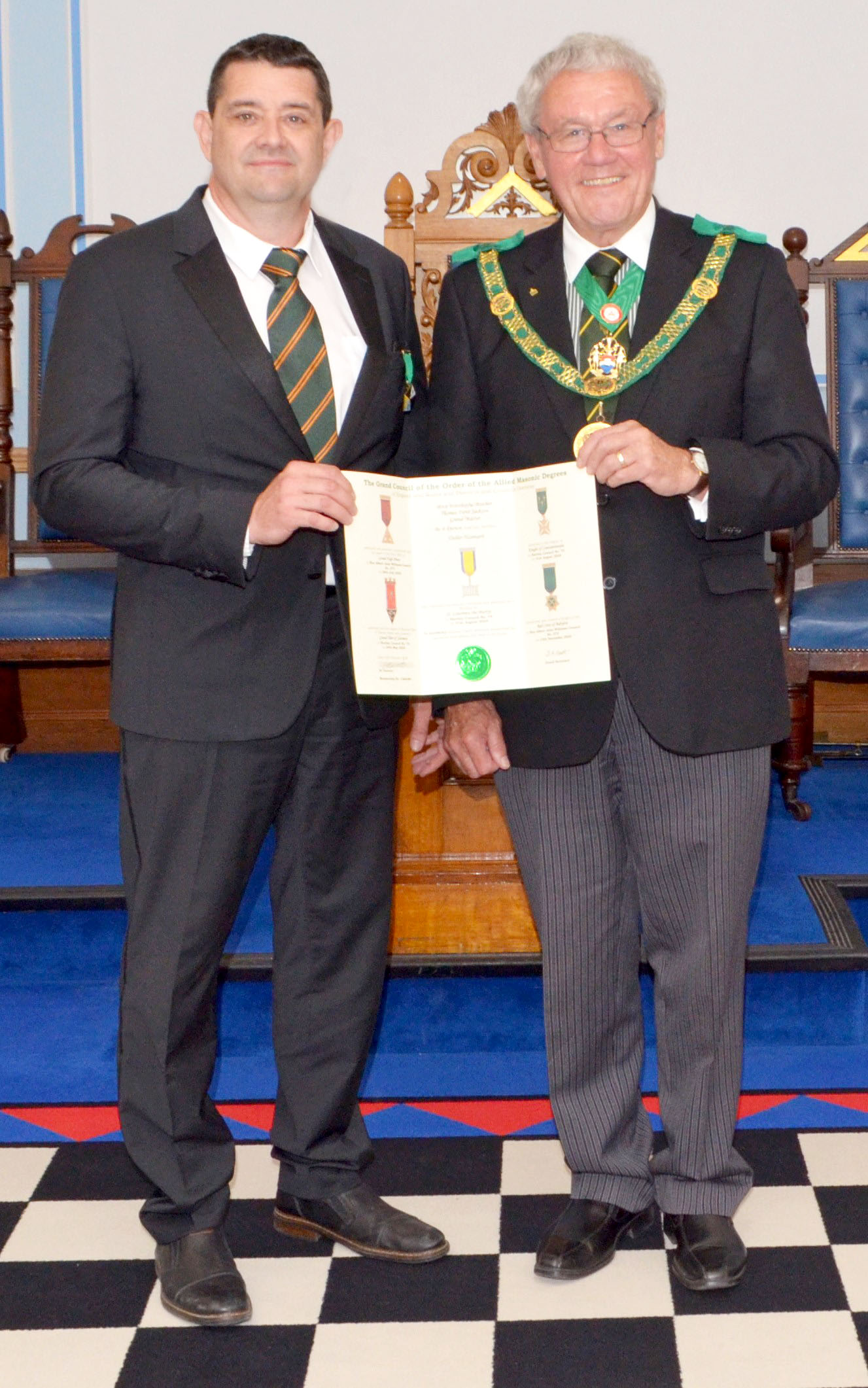 The D.G.P. R.W.Bro. Brian Ward presents the Grand Council Certificate to Bro. Didier Hannaert